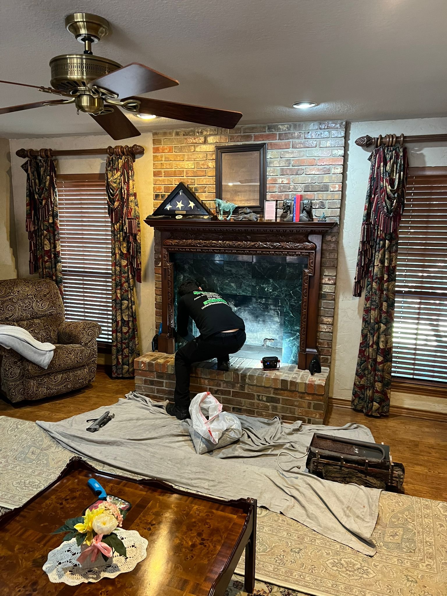 Tech is providing a cleaning for gas fireplace