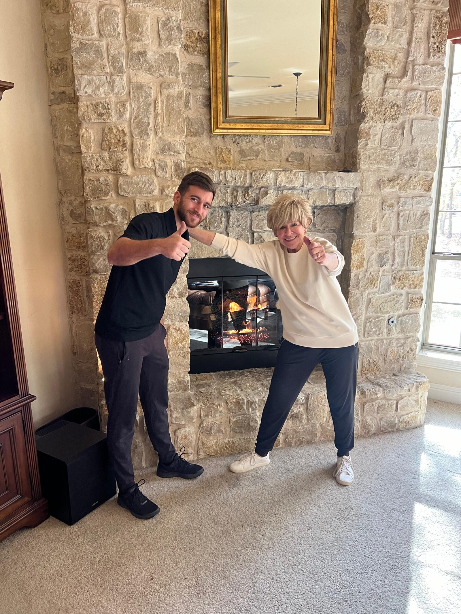 Happy costumer with United home services tech after new firebox installation