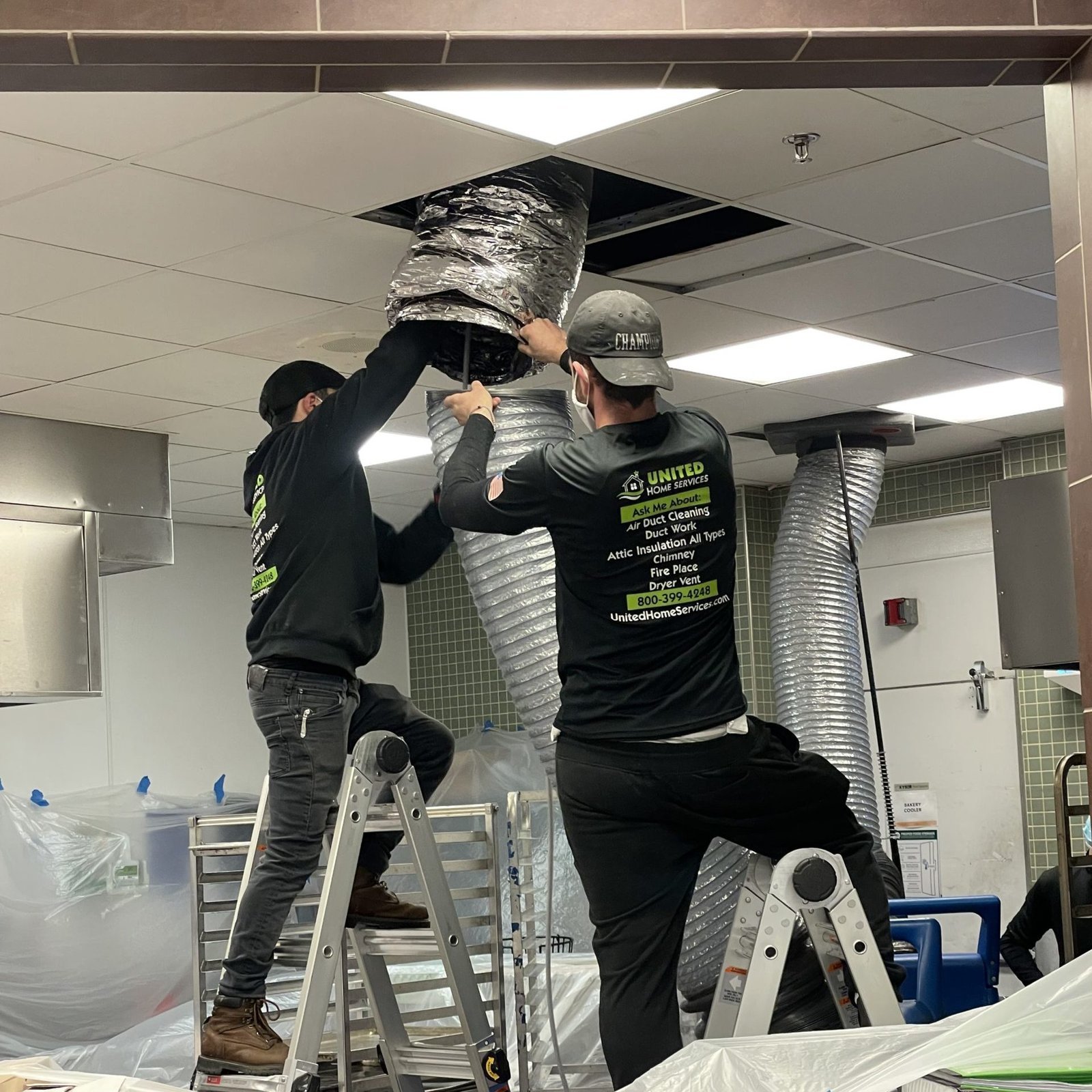 workers on ladders scaled e1648225673877